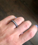 Sandwich ring with pave-set clear zircon stones